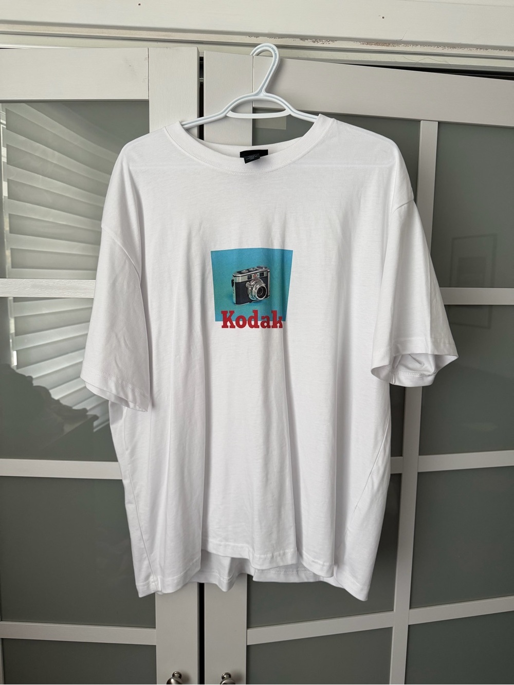 Kodak White Tee with Blue Camera Graphic and Red Logo